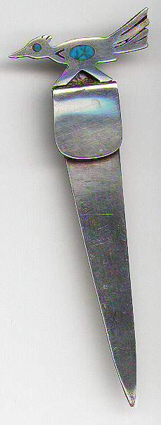 This bookmark was made in the US and signed by the renowned silversmith Frank Patania Sr. He started the Thunderbird Shop in Santa Fe, NM in 1927. The hallmarks are the 'thunderbird'", his initials FP and sterling. The top is a figural road runner with turquoise in the body and the eye. "