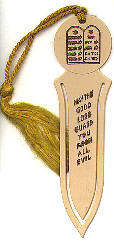 This bookmark was made in the US by an unknown manufacturer. It was made fairly recently of a beige colored plastic. It has the Ten Commandments in Hebrew on top and the words 'May The Good Lord Guard You From All Evil'" on the inner blade.  "