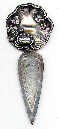 This bookmark was made in the US by an unknown manufacturer. It is marked only sterling on the front. The top is an art nouveau design of a lily pod and flower. The date is 1900 - 1910.