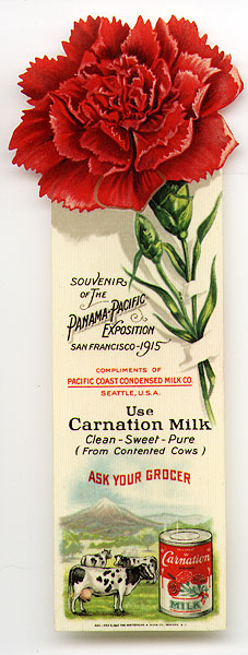 This bookmark was made in the US by The Whitehead and Hoag Co. of Newark, NJ. It is a celluloid advertising bookmark for Carnation Milk and a souvenir of the Panama-Pacific Exposition, San Francisco 1915. The top is a carnation flower and the bottom has a picture of cows and a can of Carnation Milk.  