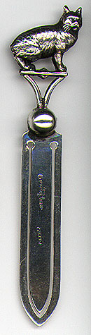 This bookmark was made possibly in the Isle of Man located in the Irish Sea in the middle of the the British Isles . It is marked EH & Co Sterling Silver. The top is a very detailed cat without a tail (a Manx). The date is 1900 - 1910.