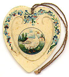  This bookmark was made in the US by an unknown manufacturer. It is a celluloid advertising bookmark for Geo. A Otis Co. of Buffalo, NY. It is in the shape of a heart with the outside decorated with blue flowers. The center blade has a picture of a duck. The date is 1905 - 1915.   
