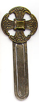 This bookmark was made in England between 1900 - 1910. It is made of silver plate over brass. The top is the Canterbury Cross and is marked as such on the back.  