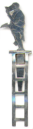 This bookmark was made in the US by Potter Mellen. It is marked Potter Mellen and their hallmark and Sterling. It is a figural of a man on top of a ladder who is reading a book with one hand, is holding a book with his other hand and has a book between his legs and under one of his arms. The date is 1900 - 1910.
