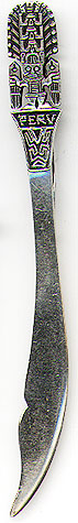 This bookmark was made in Peru by an unknown manufacturer. It is marked 925 and JR with an unknown mark. It has a figural Incan man with a large headress holding two poles. The front is marked Peru. The date is 1920 - 1930.