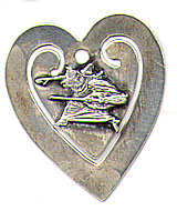  This bookmark was made in the US by Daniel Low & Co. It is marked Sterling on the back and has the famous Witch symbol on the smaller inner blade on the front. It is in the shape of a heart. The date is 1900 - 1910. 