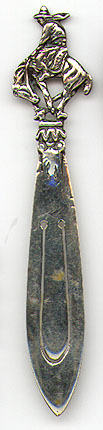 This bookmark was probably made in a South American country between 1920 and 1930. It is marked 900 with some kind of hallmark. It is a figural of a cowboy riding a bucking horse.
