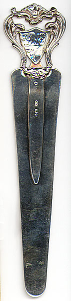 This bookmark was made in London, England in 1890. It is marked with the hallmarks and date letter for this place and date. This is a very large and heavy bookmark that was also used as a letter opener or page cutter. The top is a crest or sheild inscribed with some initials and 18 April 90.