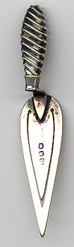 This bookmark was made in Birmingham, England. It is a Masonic piece in the shape of a trowel. It is manufactured by Addie and Lovekind. The date is 1896.