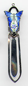 This bookmark was made in the US by an unknown manufacturer. It is marked sterling H-RCo on the back. The top is a blue enamel butterfly figural. The date is 1900 - 1910.  