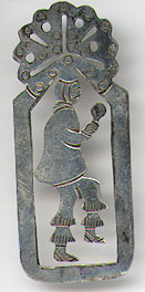 This bookmark was made in Mexico probably between 1980 - 1990. It is made of silver and is marked Mexico Sterling on the back. It is a figural of a dancer with the top being the head piece for the Fiesta de los Quetzales.