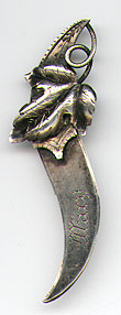  This bookmark was made in the US by an unknown manufacturer. It is marked only sterling on the back. It has a curved shaped blade with a figural of leaves as the top blade. The date is 1900 - 1910.  
