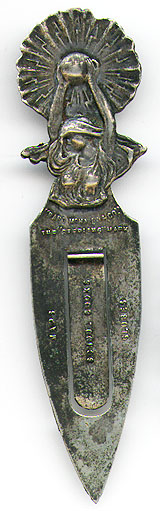 This bookmark was made in the US by an unknown manufacturer for the Rand McNally Company. It is probably silver plate and says Rand McNally & Co. "The Sterling Mark". On the blades it says Maps School Books Globes. The back is marked with the makers mark but it is undecipherable. 