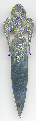 This bookmark was made in the US by George W. Shiebler & Co. It is marked with the makers hallmark, sterling and the number 2635. The top is an art nouveau design of a fleur de lis. The date is 1891 - 1910. 