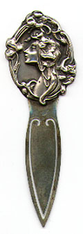  This bookmark was made in the US by an unknown manufacturer. It is marked Sterling Front on the back. It is a lady head figural on the top. The date is 1900 - 1910.  