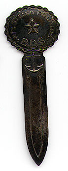 This bookmark was made in either Sweden or Norway. It is marked 830S Maase. On the top are the words M/Y Stella Polaris B.D.S. It has a 5 pointed star and an anchor. The date is 1920 - 1930.