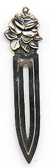 This bookmark was made in Sweden in 1952. It is marked NJ and B9 indicating 1952. It also has the Swedish import marks. The top is a figural flower of a rose.