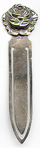 This bookmark was made in Denmark between 1920 - 1930. It is marked 830 and HGr. The top is a figural flower of a rose.