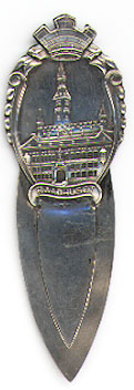 This bookmark was made in Norway between 1920 - 1930. It is marked 830S and H&A. The top says Raadhuset with a picture of a building.