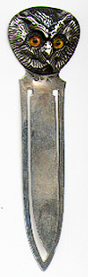 This bookmark was made in Sweden between 1910 - 1920. It is marked O.M.M. and 880S. The top is a figural of the face of an owl with glass eyes.