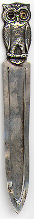 This bookmark was made in Germany between 1900 - 1910. It is marked Sterling 935. The back is inscribed "With compliments of the Bristol Hotel Berlin". The top is a figural of an owl with glass eyes.