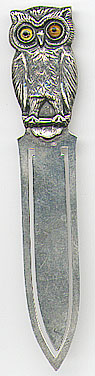 This bookmark was made in Denmark between 1910 - 1920. It is marked 830S and has an unidentifed hallmark. The top is a figural owl with glass eyes. It is very similar to 551.