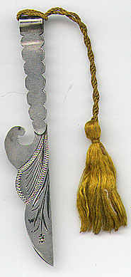 This bookmark was made in the US by Henry Haskell manufacturer. It is marked Sterling and has a manufacturers hallmark with the letters HNY. It is in the shape of a knife where the top folds over to create the top blade. It is very similar to 208. The date is 1900 - 1910.  