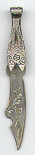  This bookmark was made in the US by an unknown manufacturer. It is marked only Sterling. It has intricate design on the top blade and an engraved cut design on the bottom blade. The date is 1900 - 1910.  
