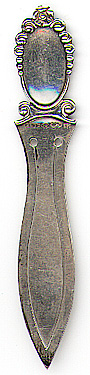 This bookmark was made in Sweden in 1958. It is marked K & EC with other marks and H9 as the date mark for 1958. It is thin with the classic Swedish blade shape. The top is a sheild which would be where an engraving would go.