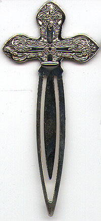 This bookmark was made in the US by Wallace Silversmiths. It is a new bookmark, made in 1998 and is marked Wallace Sterling 925. The top is a cross with scroll work around the edges.  