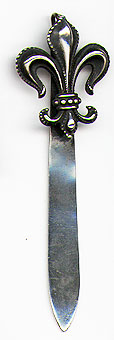This bookmark was made in the US by Link, Angell and Weiss. It is marked Sterling and L W A in a linked chain. The top is a figural fleur-de-lis. The date is 1890 - 1900.  