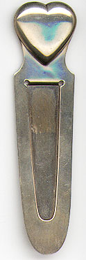 This bookmark was made in the US by Tiffany and Co. It is marked Tiffany and Co. Sterling Makers and the letter L. The top is a figural heart. The date is 1930 - 1940.  