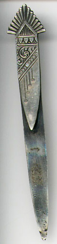 This bookmark was made in the US by Shiebler for Tiffany and Co. It is marked Tiffany and Co. Sterling and has the Sheibler hallmark and the number 1196. It's an interesting design, sort of arts and crafts. The date is 1890 - 1910.  