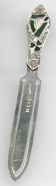 This bookmark was made in Birmingham, England in 1900. It is marked with the standard English hallmarks. The top has an interesting Irish design with inlaid pieces of Commemara marble. 