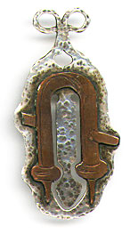 This bookmark was made in the US possibly by Gustav Stickley. It is copper and silver and is hallmarked with an unknown mark. It is hand made in the Arts and Crafts style. The date is 1910 - 1920. 