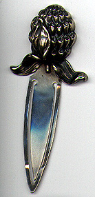 This bookmark is a William B. Kerr & Co. piece. It has the American Beauty hallmark, sterling and is stamped 1988. It is a high relief flower and was made around 1900.
