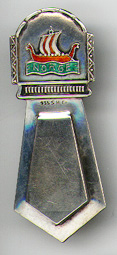 This bookmark was made in Denmark between 1940 - 1950. It is marked 935S and H Gr. The top is an enamel picture of a Norse ship with the word NORGE underneath. 