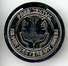 This bookmark was made in the US by Gorham. It is a commemorative bookmark marking the Presidential Silver Anniversary Award. The back is marked Gorham with a hallmark and Sterling. The date is 1990s. 