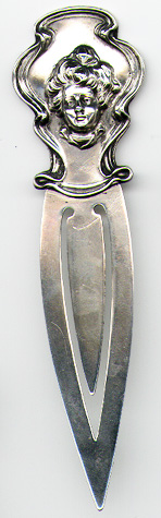 This bookmark was made in the US by Unger Bros. It is marked with the manufacturers mark of an intertwined U and B surrounded by Sterling 925 Fine. It is a high relief head of a victorian lady within a sheild.  This is a very rare piece.  