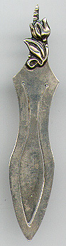 This bookmark was made in Denmark. It is marked Sterling Denmark and the number 700 stamped over. It is a figural tulip on the top. The date is 1950 - 1960.