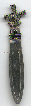 This bookmark was made in Holland and has a windmill figure on the top. The blade of the windmill actually spin. The mark on it is a sword tilted slightly to the left. This inicates the fineness of the silver to be between .934 and .833. The mark was used until 1953.