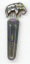 This bookmark was made in Glasgow, Scotland in 1920. It is marked with the hallmarks for this time and place and W.W.C for the manufacturer. It has a figural elephant on top balancing on two feet.