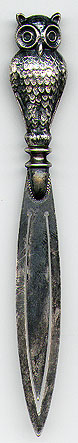 This bookmark was made in England. It is marked C&N Silver. The top is a three dimensional figural owl. The date is unknown.