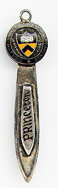 This bookmark was made in the US by an unkown manufacturer. It is marked sterling and something else that can't be made out. The top is a an orange and black enamel shield surrounded by the words "Sigillum Universitatis Princetoniensis." The top blade reads "Princeton" in enamel writing. The date is 1920 - 1930. 