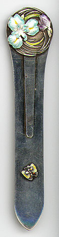 This bookmark was made in China by an unknown manufacturer. It is completely unmarked but has been tested to be sterling. The top blade is a beautiful enamel flower and leaves and the large blade has a small enamel butterfly at the bottom. The date is 1900 - 1910.