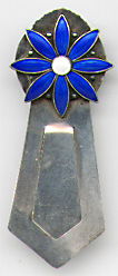 This bookmark was made in Norway. It is marked 830S with an H hallmark. The top is a figural flower with blue enamel petals and a white enamel center.  The date is 1920 - 1930.  