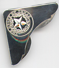 This bookmark is American made by The Gorham Corporation. It is marked Gorham Sterling . It is a corner bookmark made for a jewelry store probably in Texas. The top is a seal of Texas with a 5 pointed star surrounded by a wreath surrounded by the words "The State of Texas".   