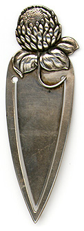 This bookmark was made in the US by Parks Bros. & Rogers. It is marked with the manufacturers hallmark surrounded by the word sterling. The top is a figural flower. The date is 1900 - 1910.  