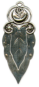 This bookmark was made in Sweden by an unknown manufacturer. It is marked with the Swedish hallmarks and the date letter V7 for 1922. It is in the shape of a leaf with a flower on top. It is very similar to the Georg Jensen bookmark number 103.