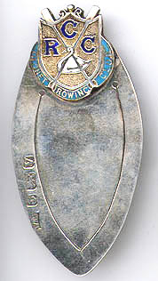 This bookmark is made in Birmingham, England. It is marked with the the date mark of 1920 and the hallmarks for Birmingham. It is silver and enamel and has the shield of the Cygnet Rowing Club. 
